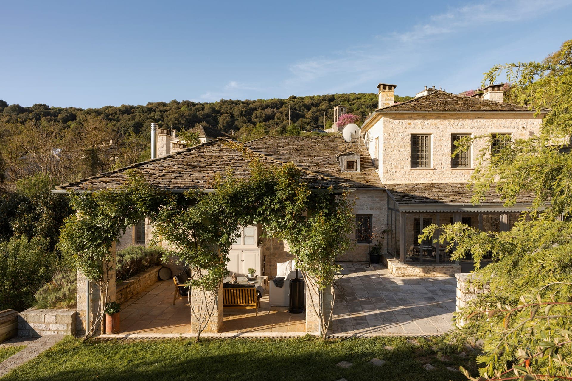 Main courtyard and exterior of the historic Apeiros Chora mansion.