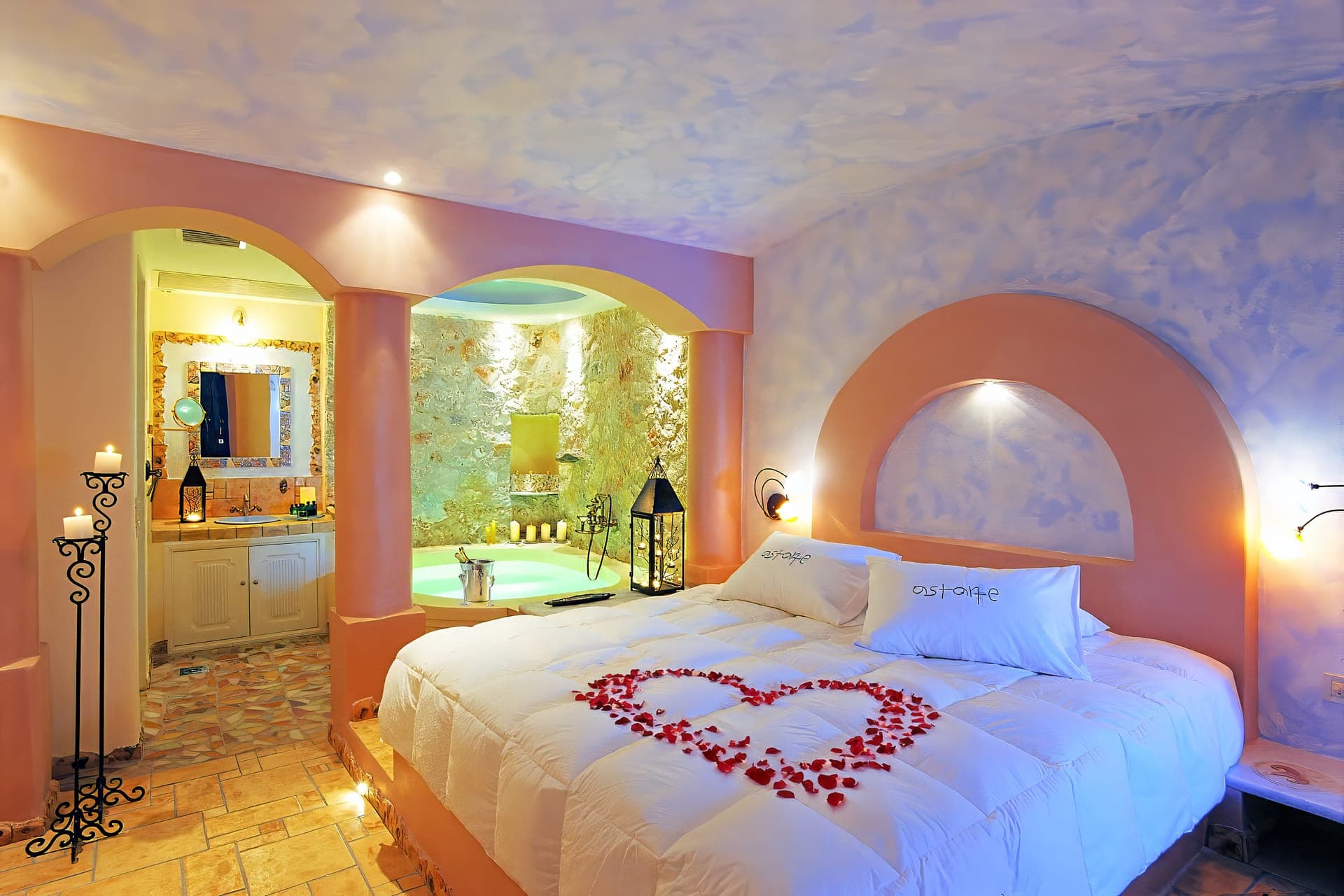 Junior suite with private indoor couples Jacuzzi and private balcony with sea/volcano/caldera view | Astarte Suites Luxury Hotel in Santorini