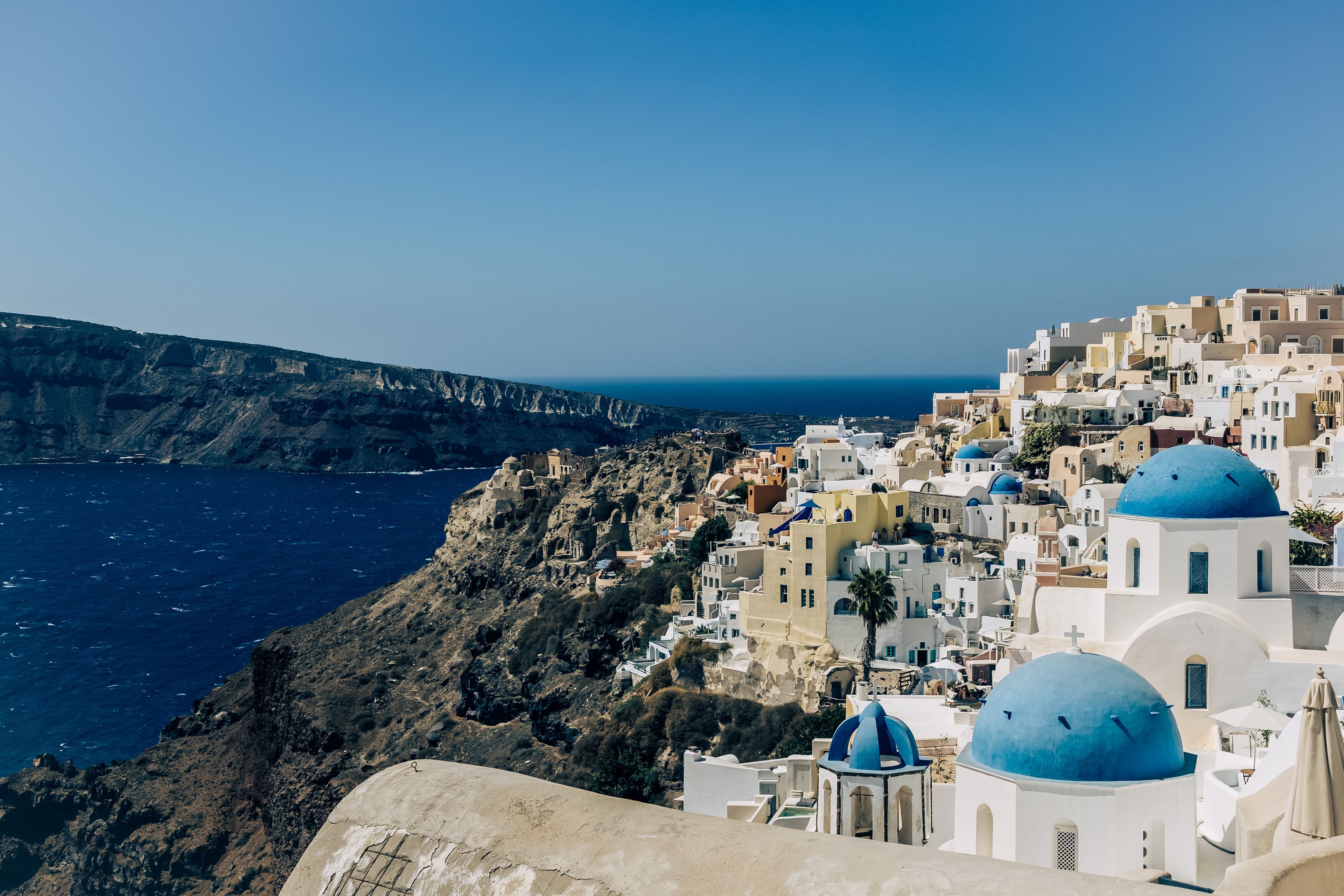 Blue-domed churches overlooking the caldera in Oia, Santorini